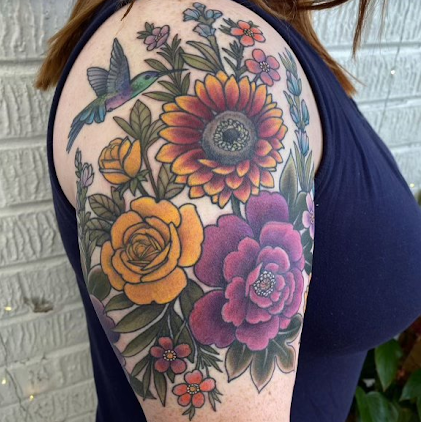 Tattoo of face in flowers